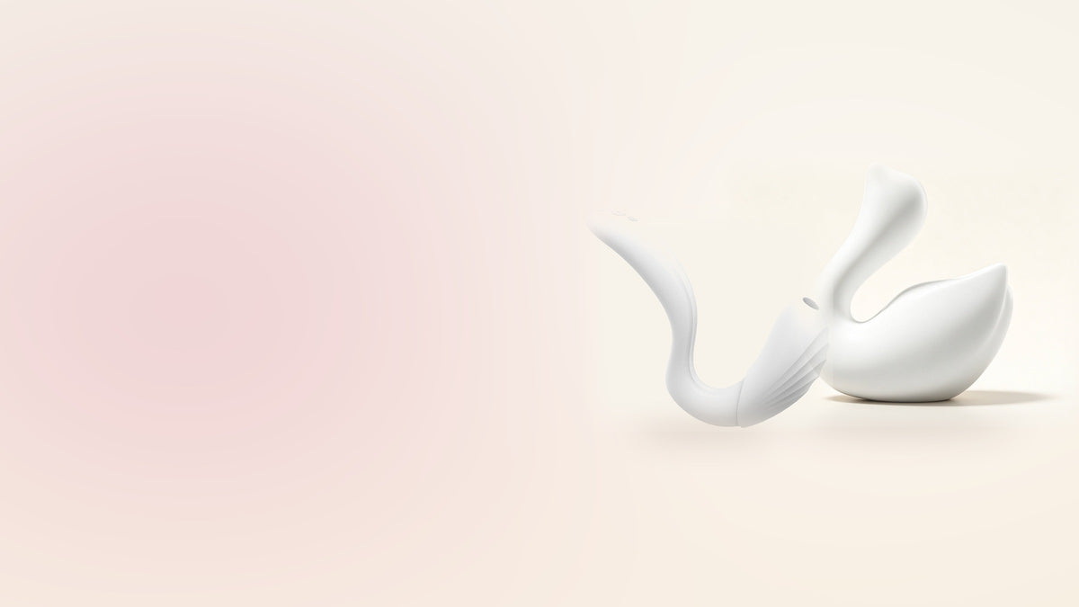 CD-HOMES body-safe silicone vibrators - the Zhiji Swan and the Flexible Heated Vibrator on a soft cream background
